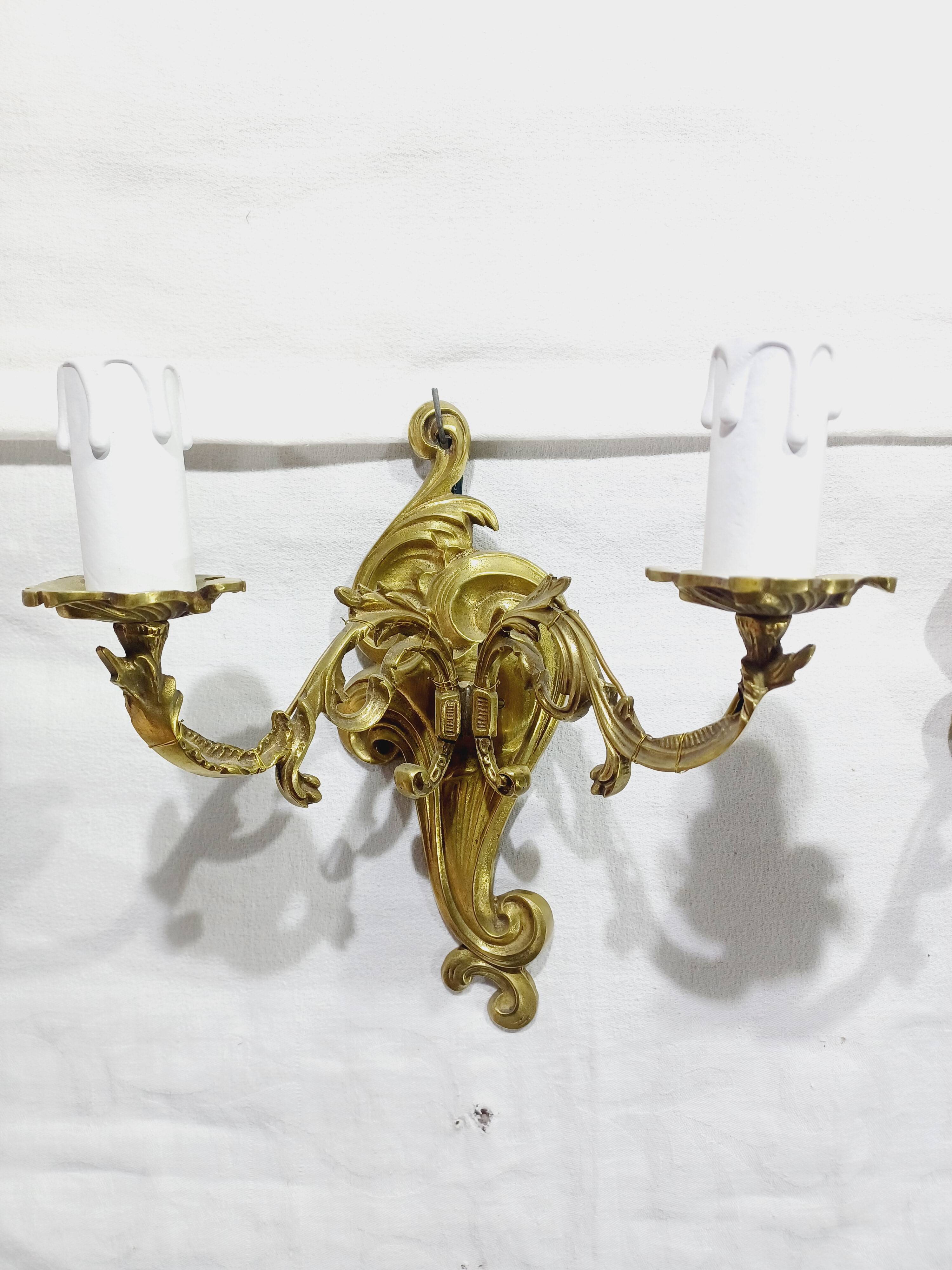 Pair of 2-light bronze wall lights, St. Louis XV
