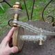 Adjustable double-arm wall light in plexiglass and brass, 1950.