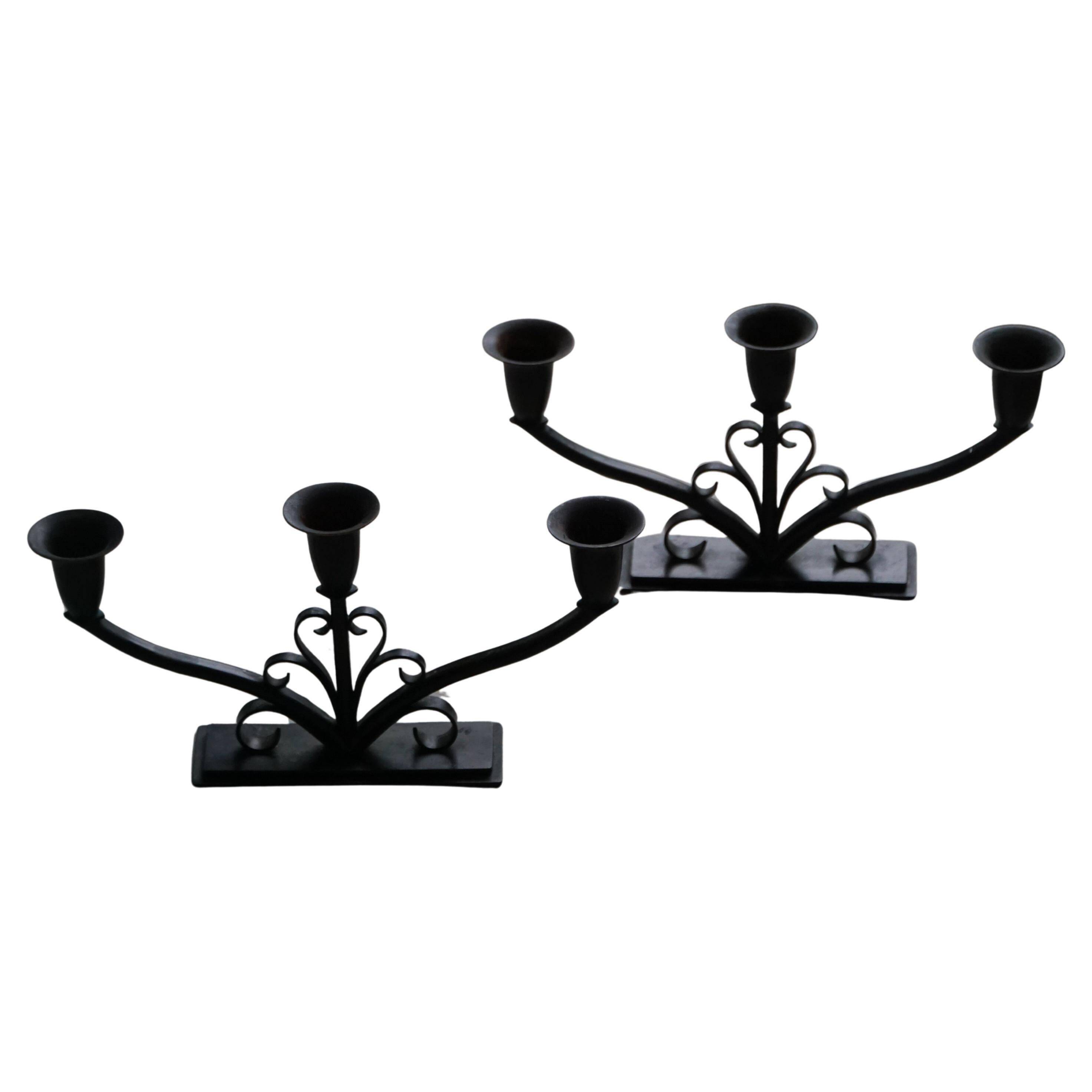 Early 20th century, pair of Danish Art Deco candlesticks in metal with three arms, 1930s.