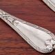 Christofle, Paris - Set of 2 table spoons - Crossed Ribbons model - in silver-plated metal