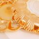 Pair of iridescent orange glass egg plates