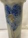 Artisanal vase in gray sandstone flower pattern