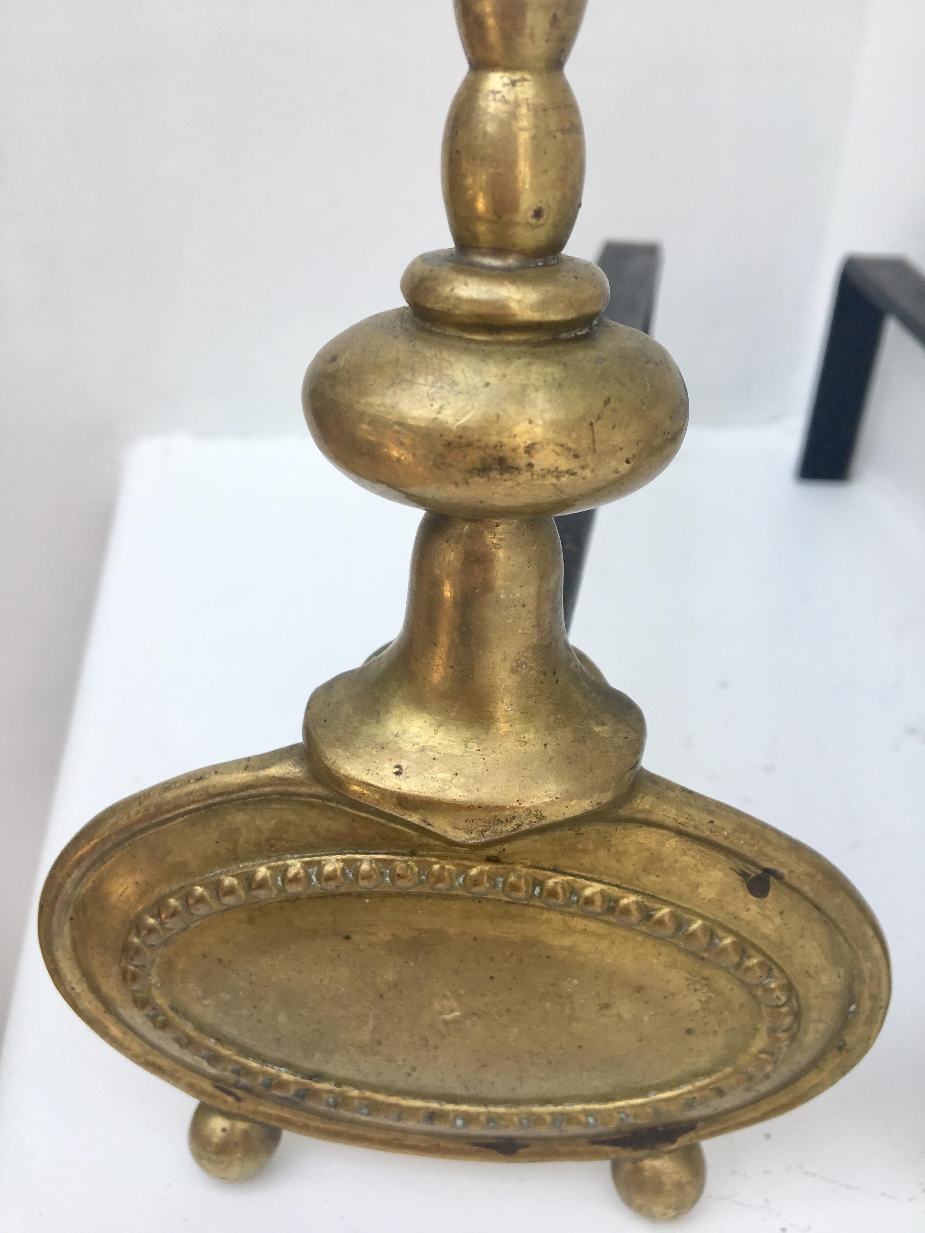 Pair of andirons in brass for fireplace