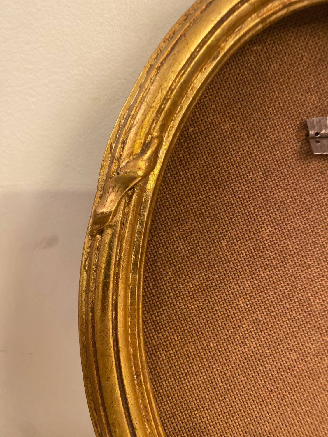 Golden oval wooden frame