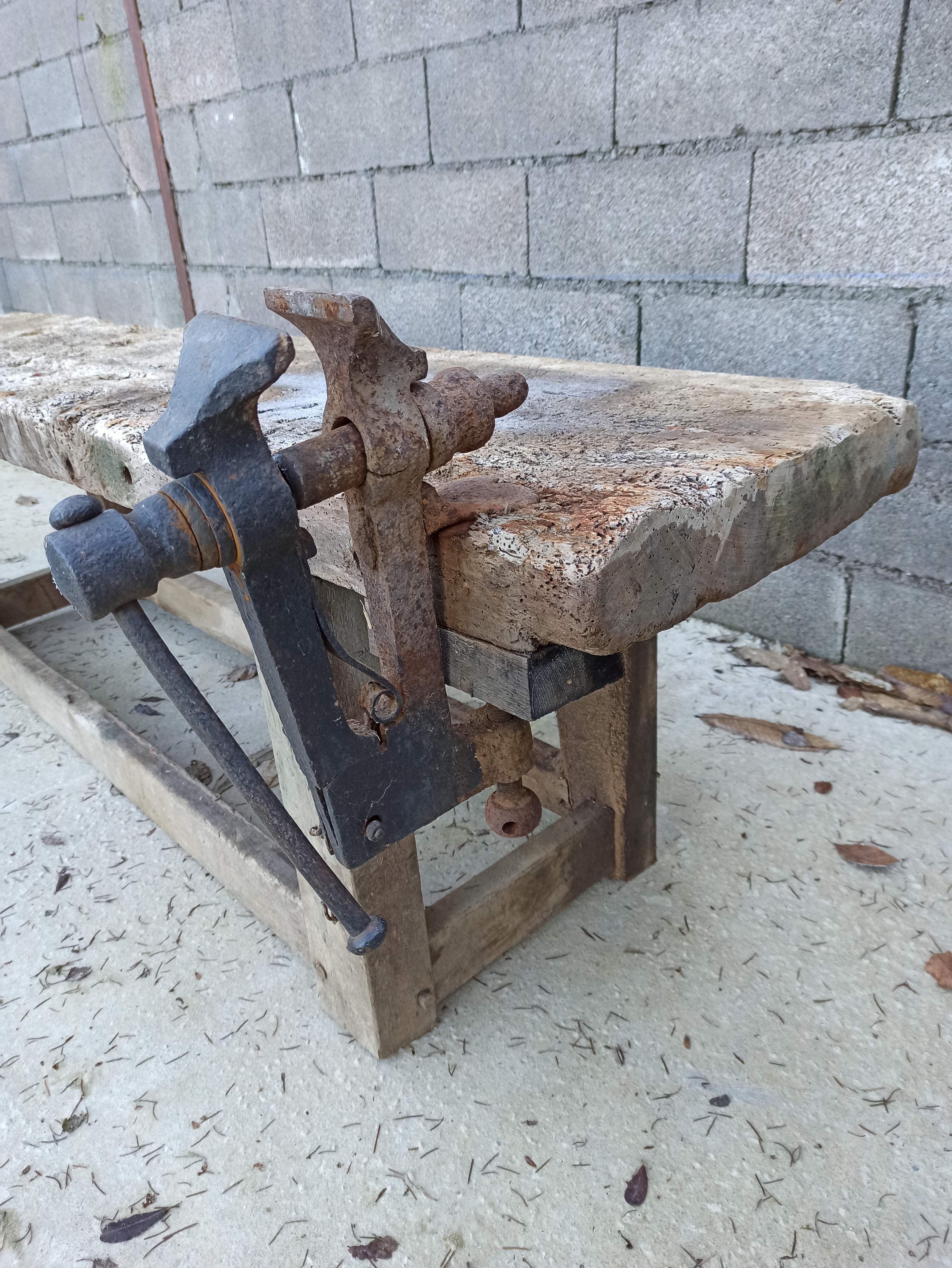 Wooden carpenter's workbench with iron and wooden vice
