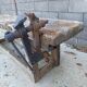 Wooden carpenter's workbench with iron and wooden vice