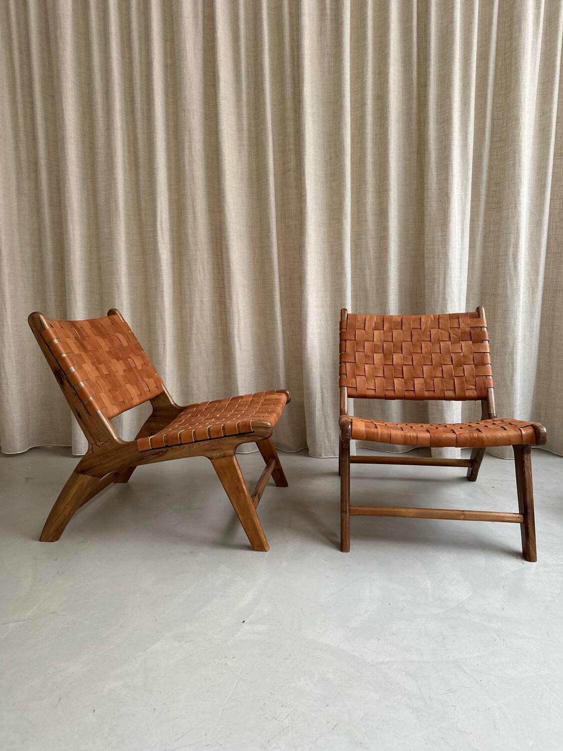 Pair of leather and walnut armchairs