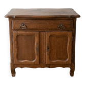 Rustic low cabinet in wood with herringbone marquetry.
