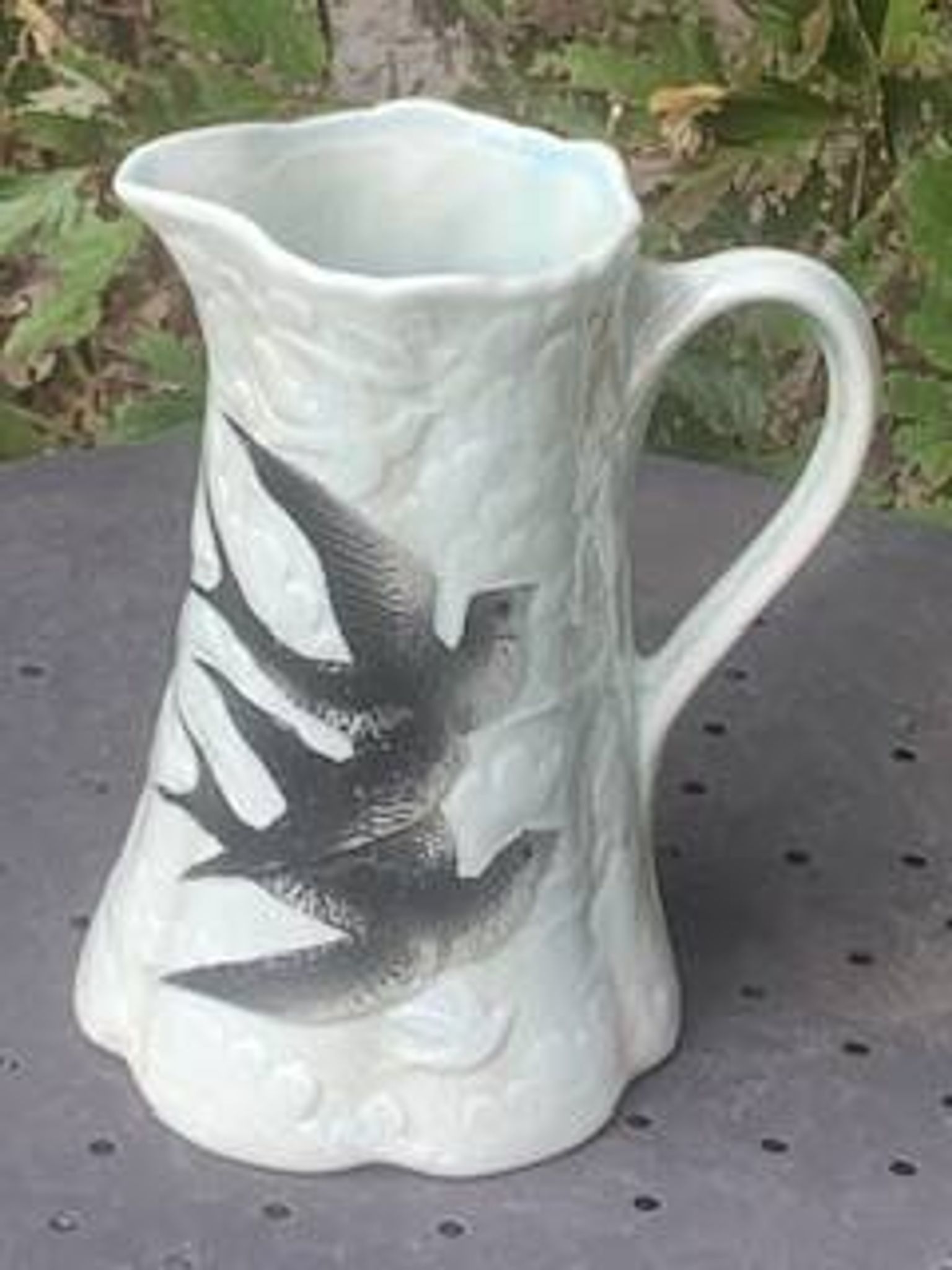 Jade green ceramic barbotine vase with swallows.