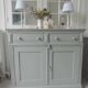 Antique sideboard enhanced in verdigris, wooden top.