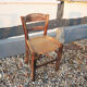 Old woven straw children's chair
