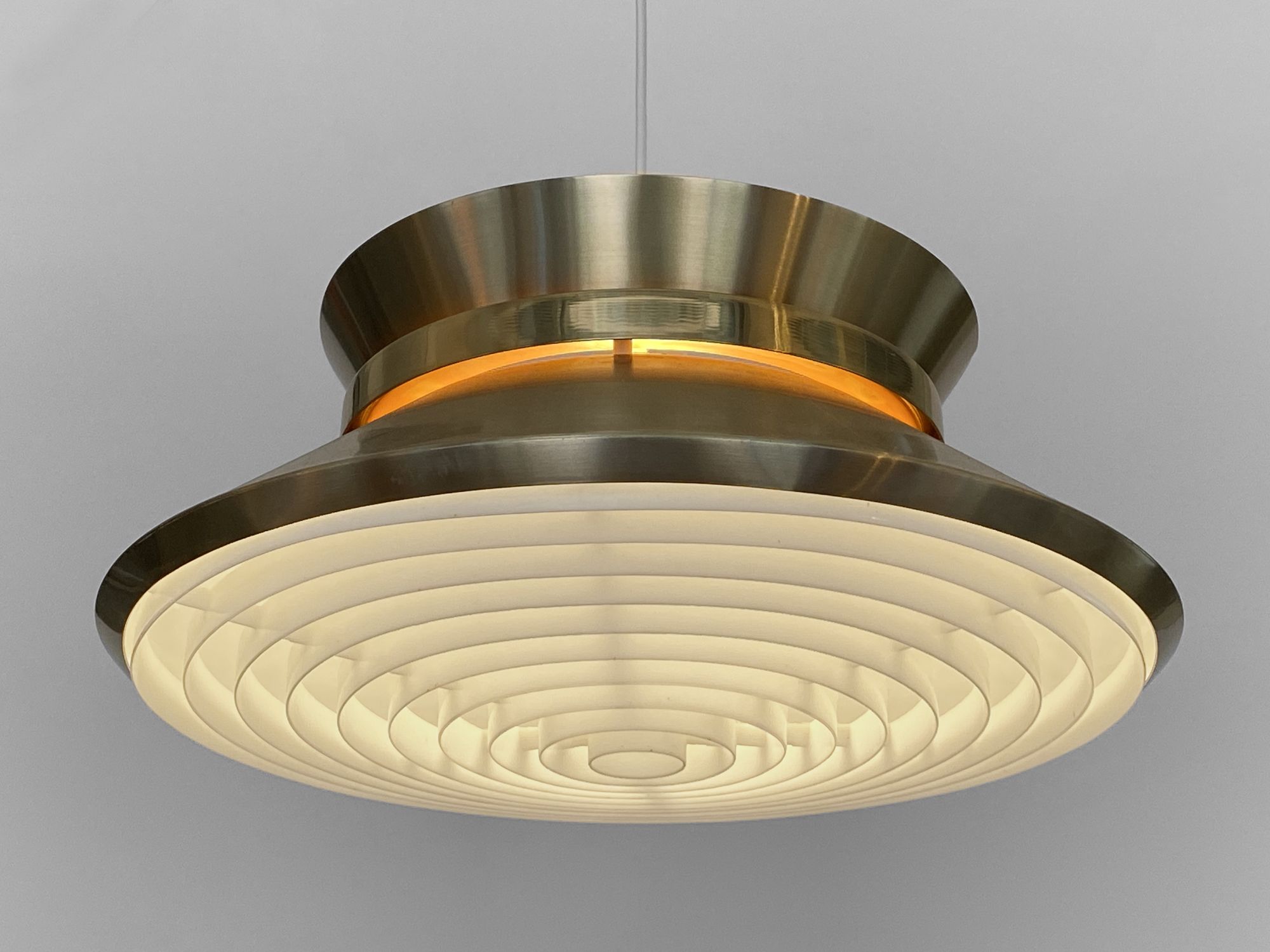 Brass colored aluminium pendant light by Carl Thore for Granhaga Metall. Sweden 1970s