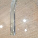 Dining table with smoked glass top and chrome base.