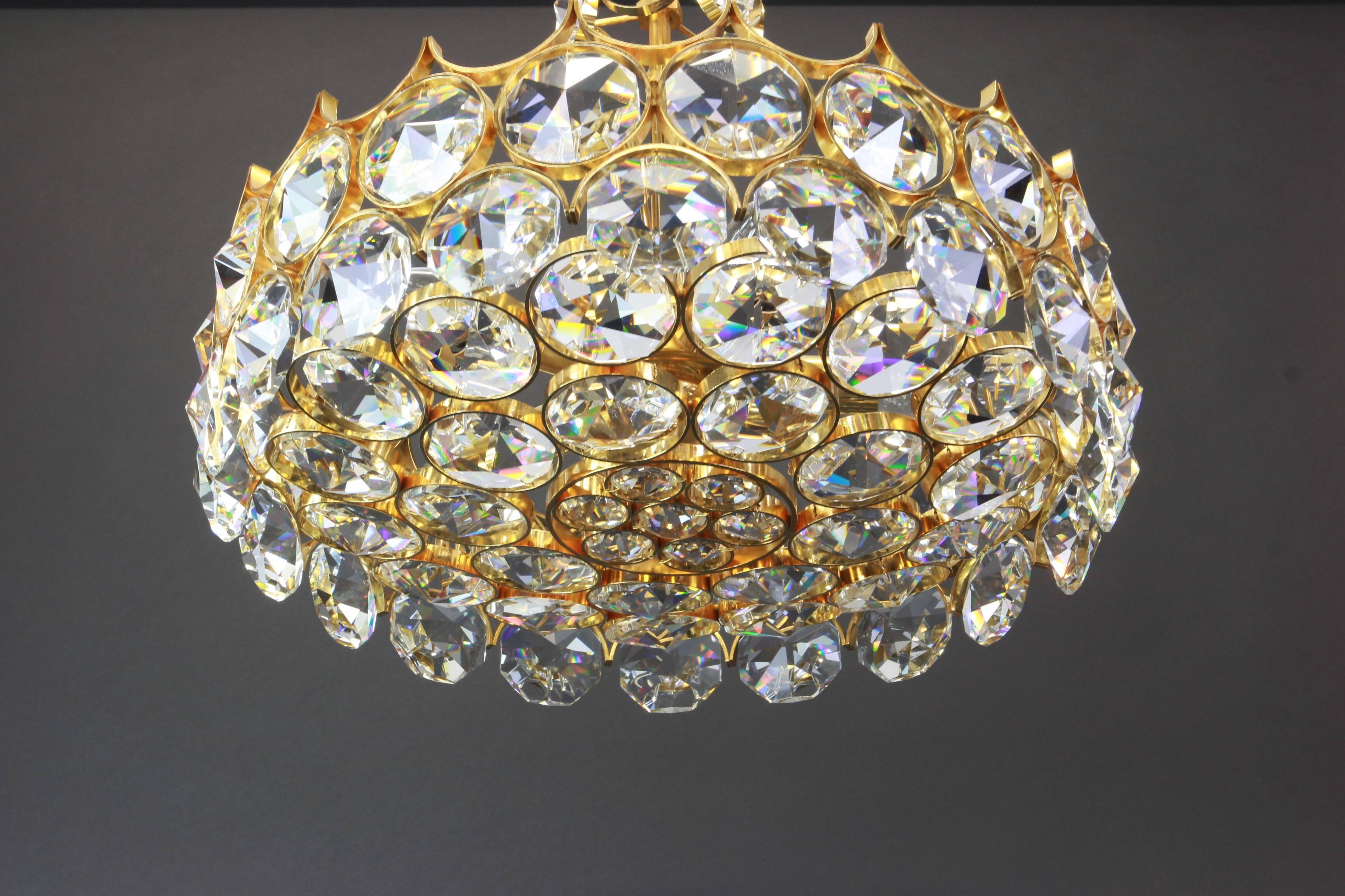 Chandelier in gilded brass and crystal glass inlaid by Palwa, Germany, 1970s.