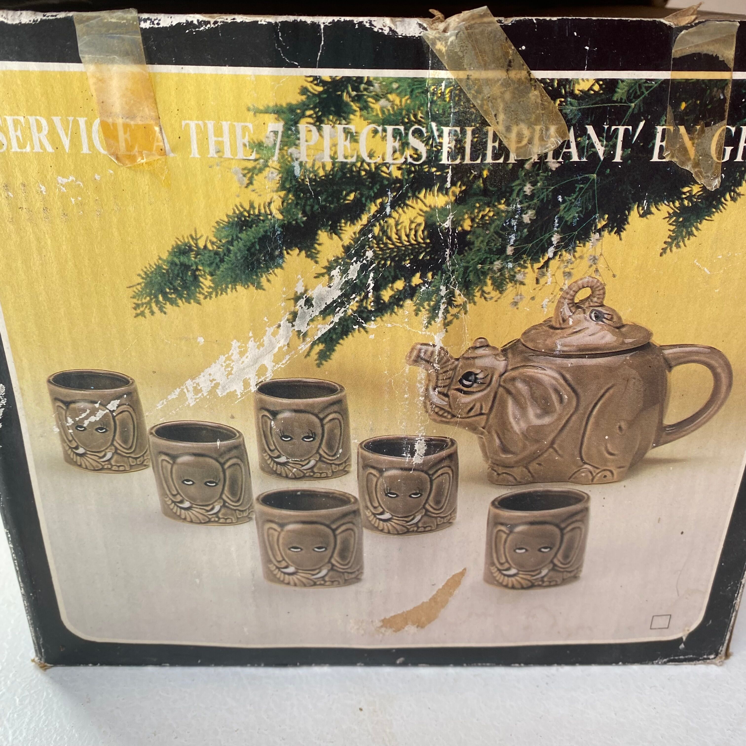 Vintage teapot and vintage elephant cups