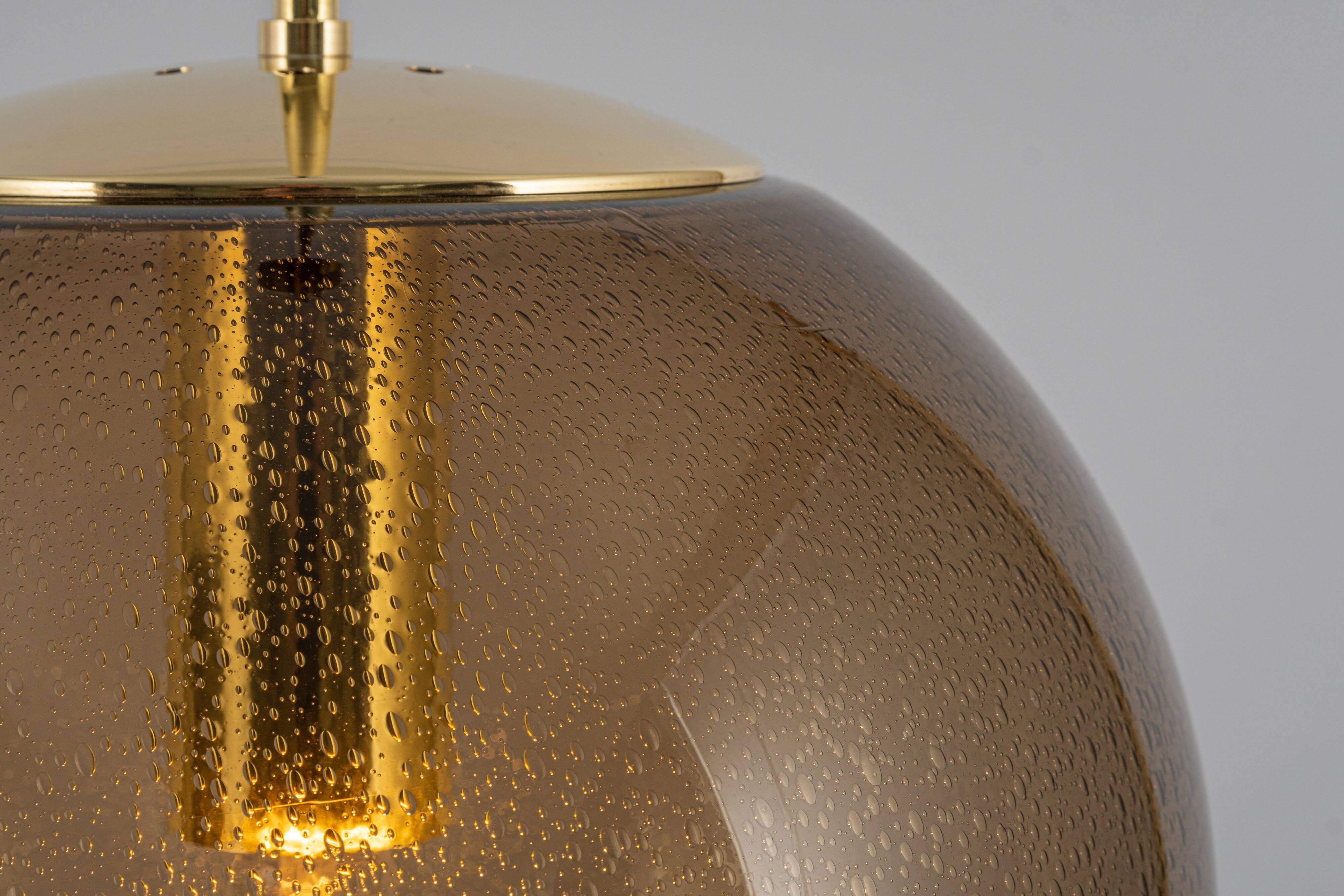 Large smoked glass ball pendant by Limburg with brass, Germany, 1970s.