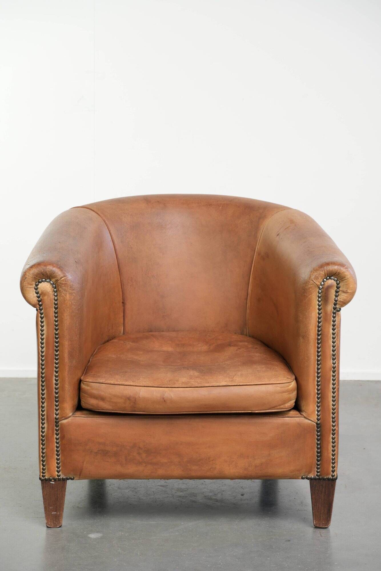 Vintage sheepskin club armchair in a beautiful light cognac colour