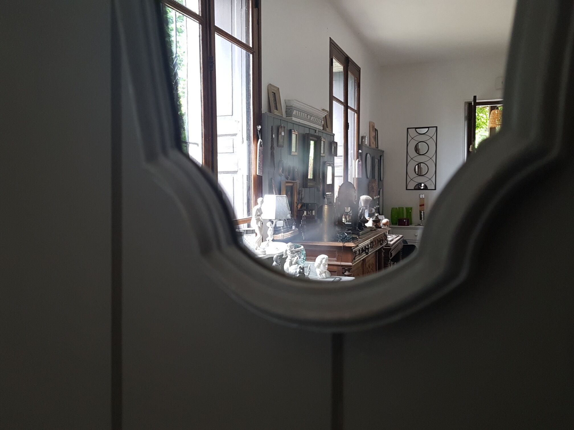 Grey patinated baroque mirror