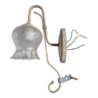 Vintage metal wall light fixture with aged effect glass globe with flower designs