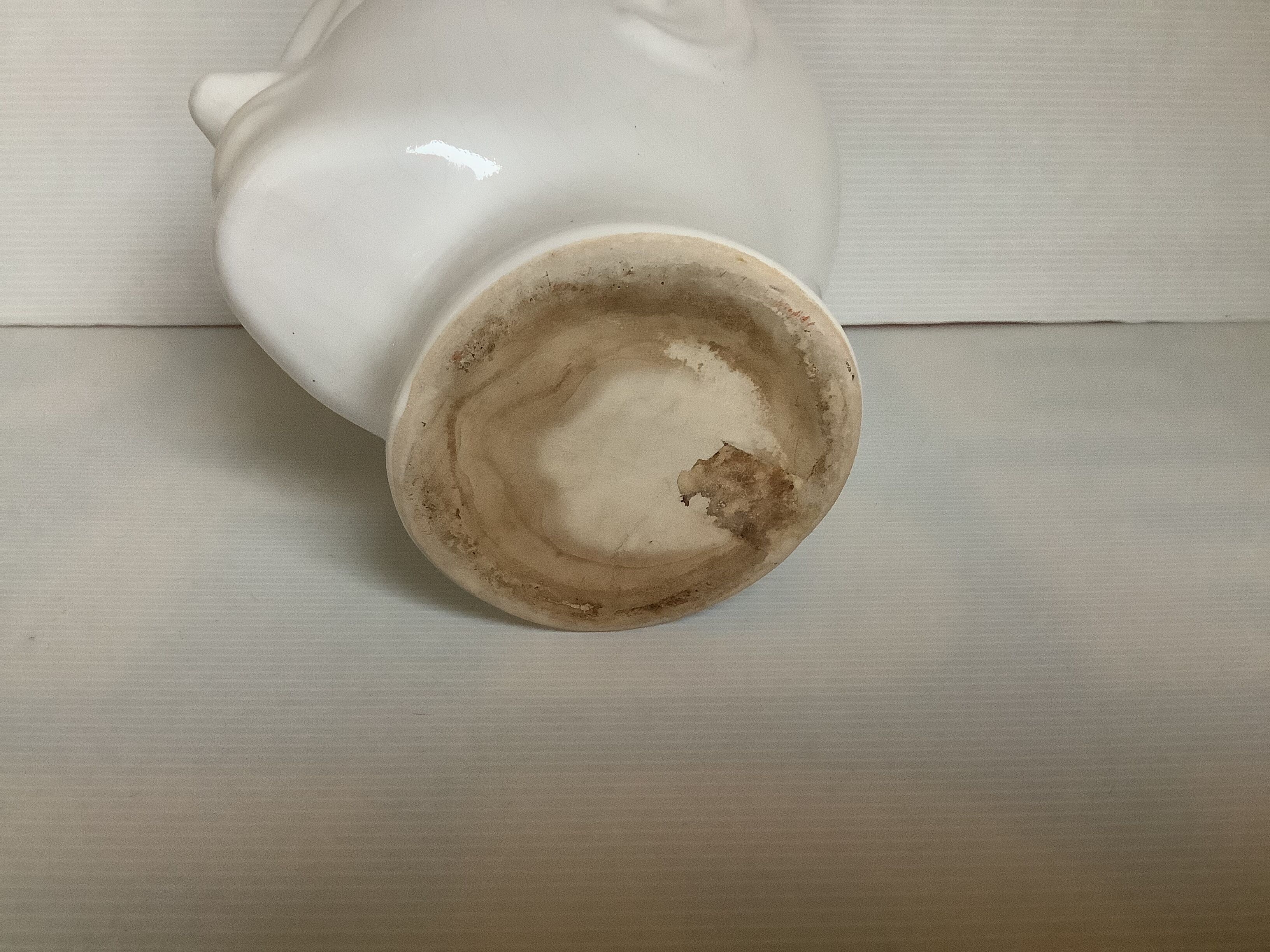 Man's head hide pot vase