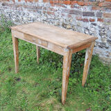 Old wooden farmhouse table with drawer