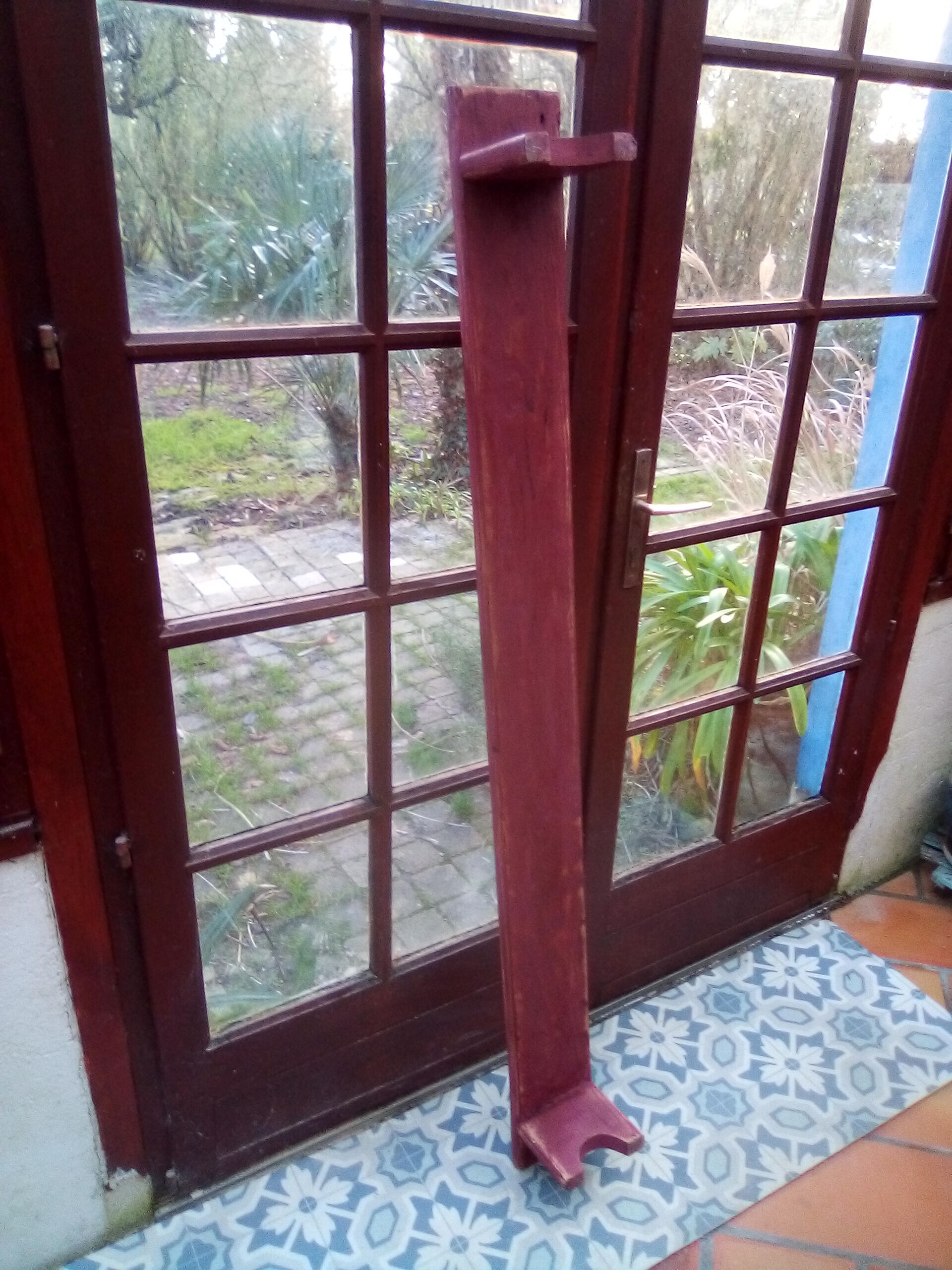Low bench rests feet in patinated wood