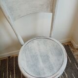 White antique children's chair in patinated wood