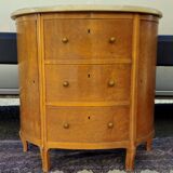 Half-moon commode in burl wood with a marble top.