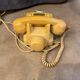 Old dial telephone from the 80s temat quimper bakelite yellow and beige