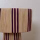 Table lamp in natural raffia with purple stripes