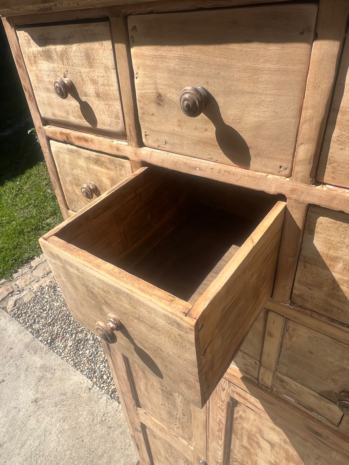 Beautiful piece of furniture with 8 drawers/2 doors in raw wood.