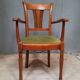 Modern armchair in varnished wood