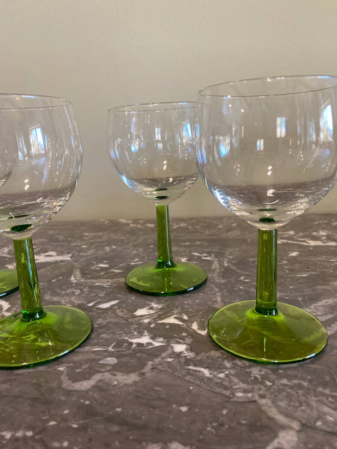 4 green stemmed glasses
