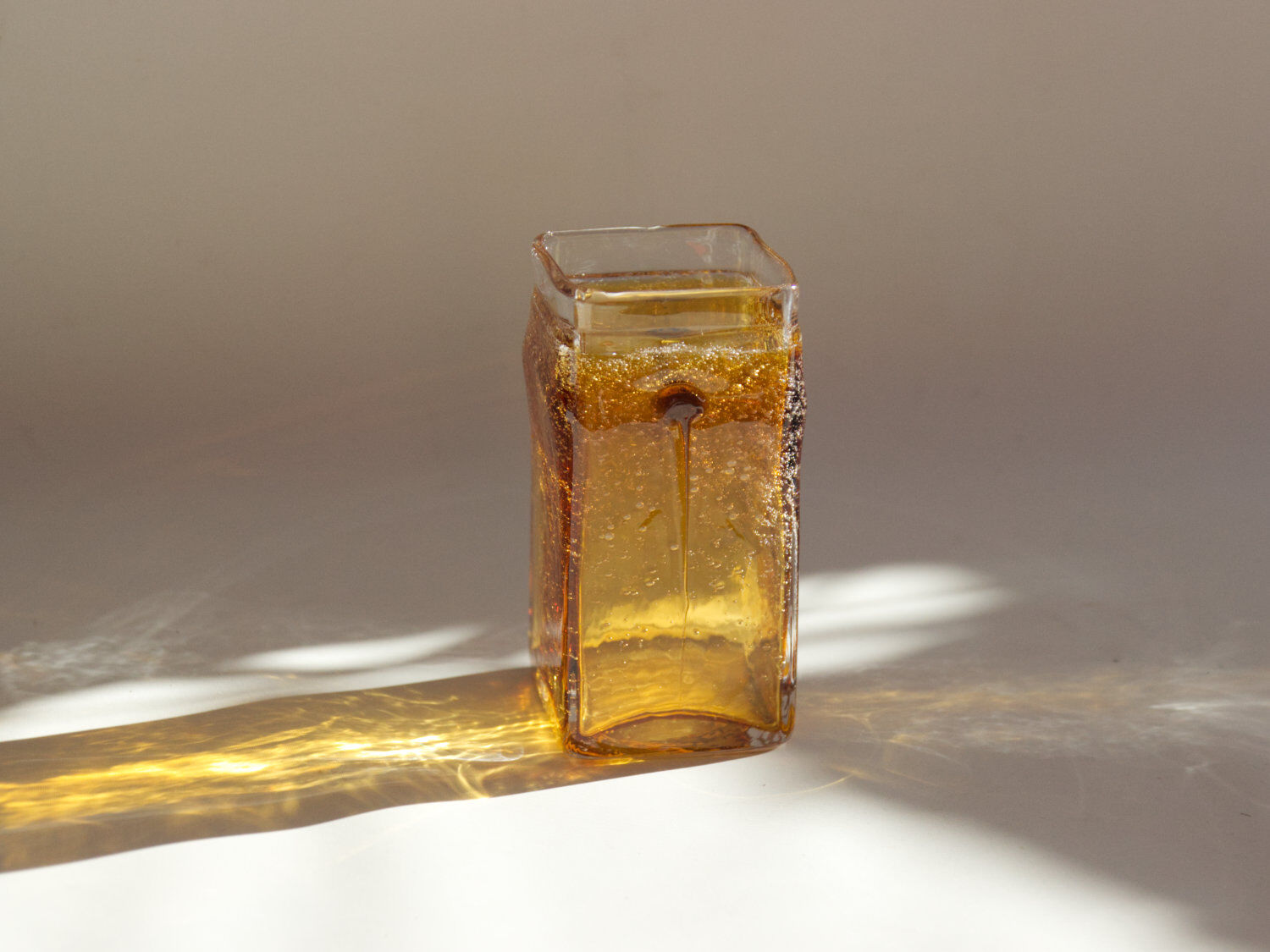 Amber vase made of bubbled glass