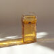 Amber vase made of bubbled glass
