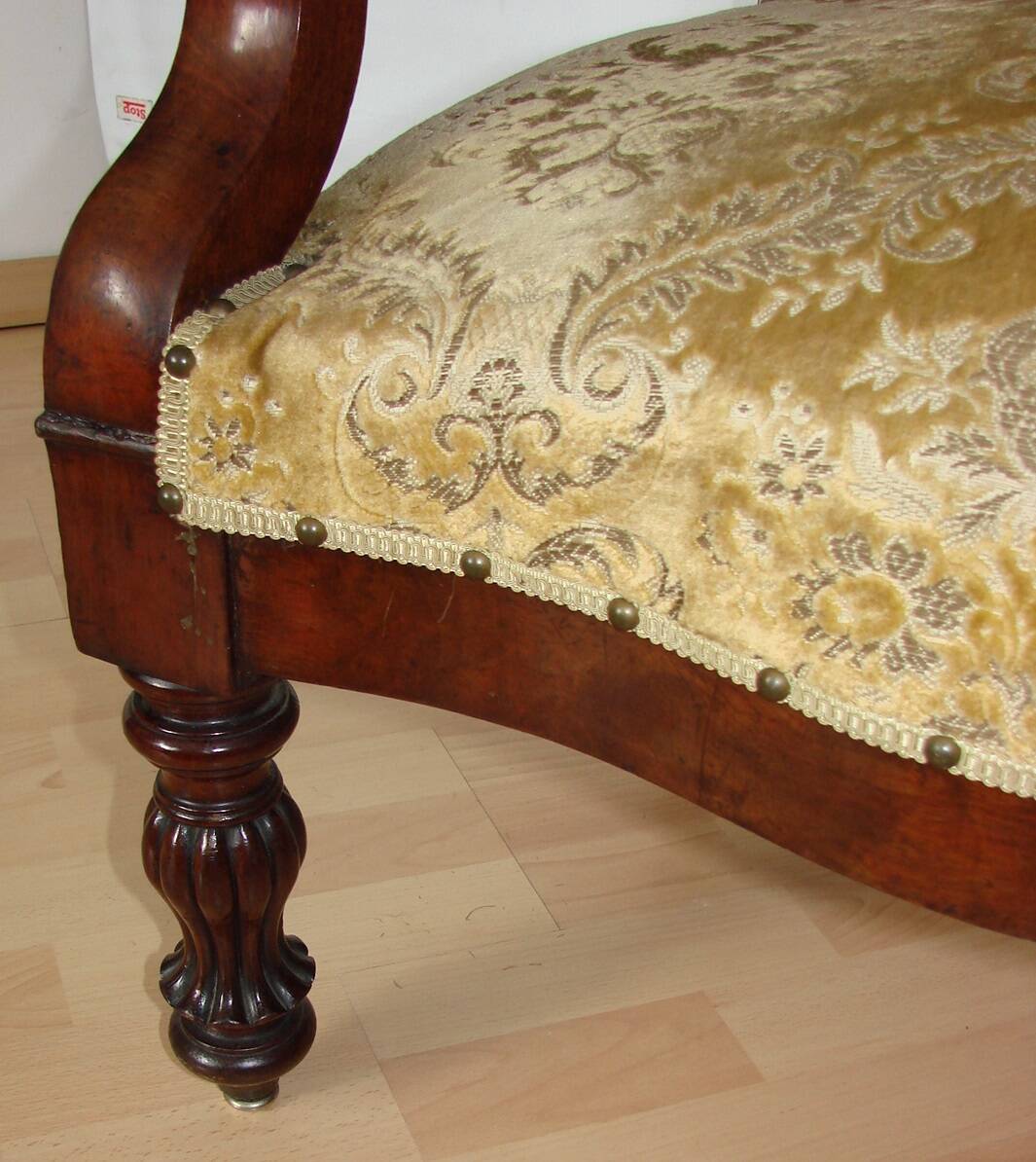 An antique armchair from the turn of the 19th and 20th centuries, carved wa
