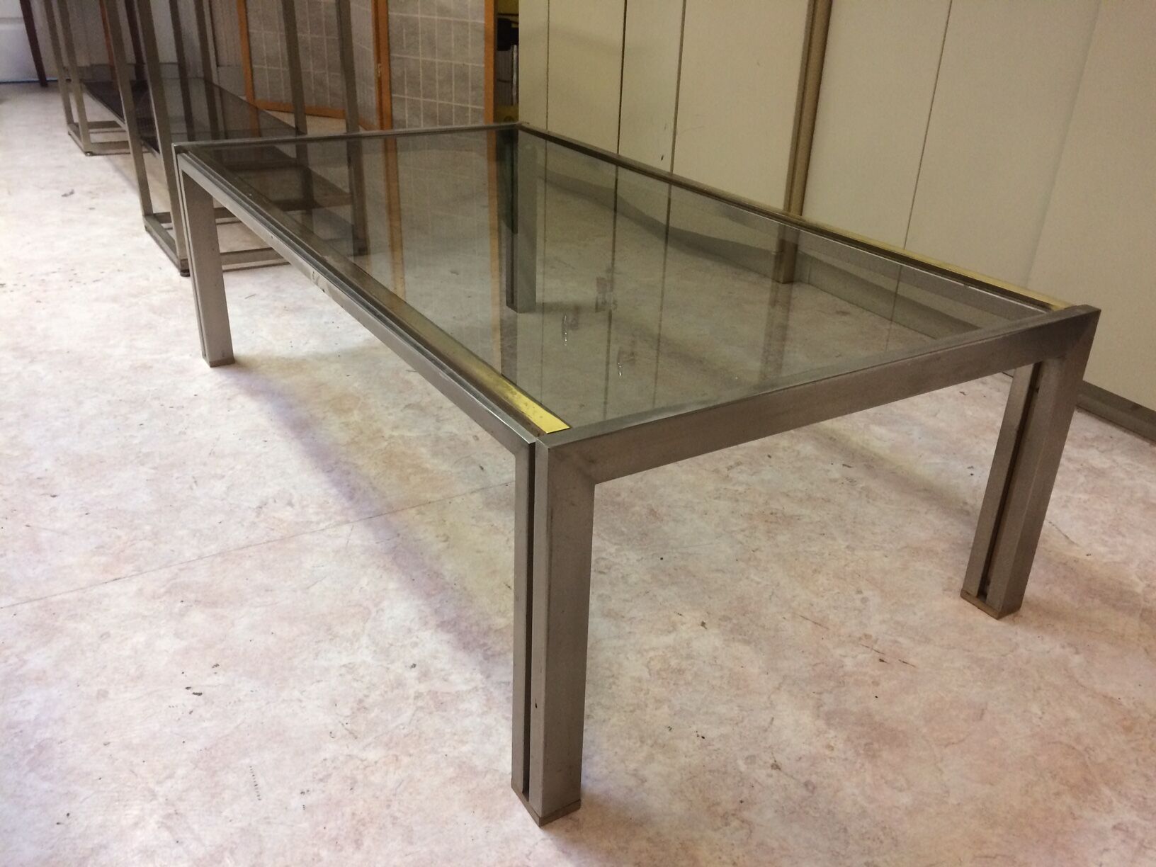 Coffee table with square tubular structure and smoked glass - 1970
