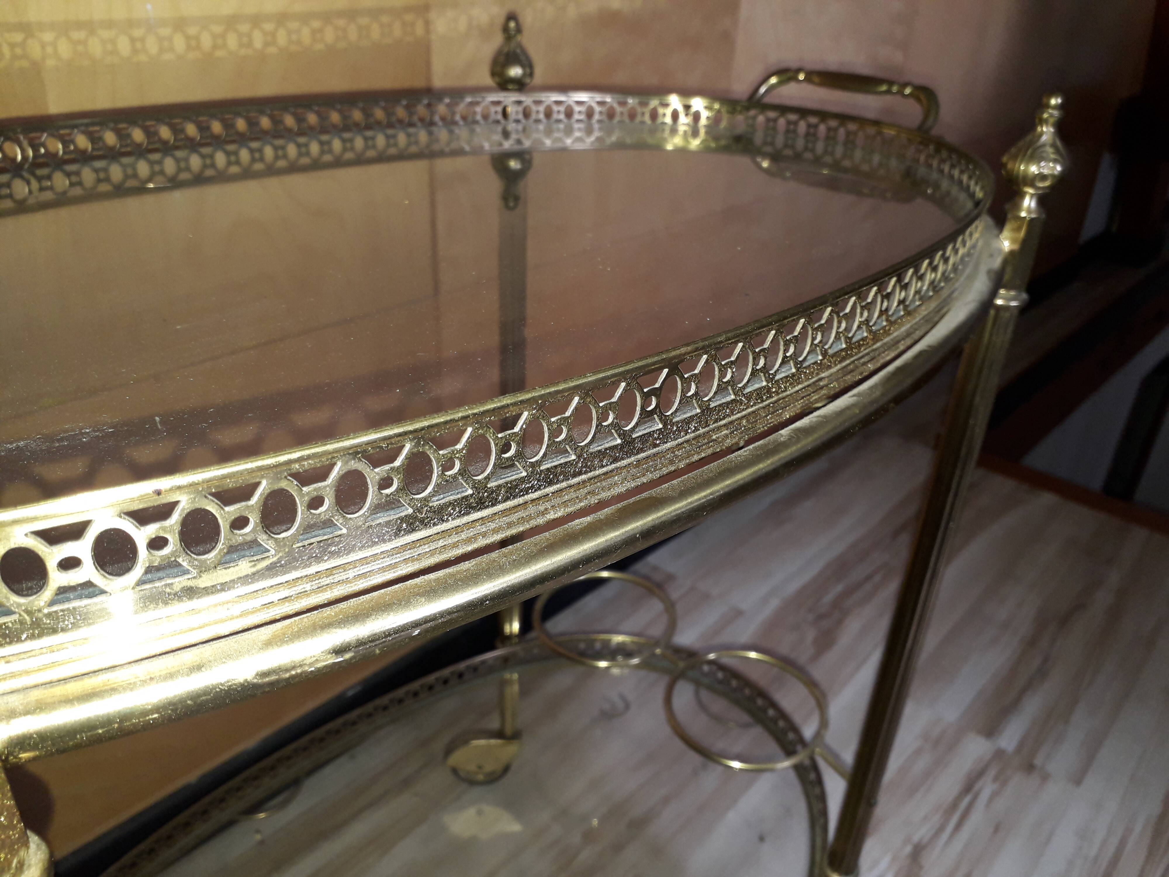 Dessert on brass wheels and glass door bottles year 60