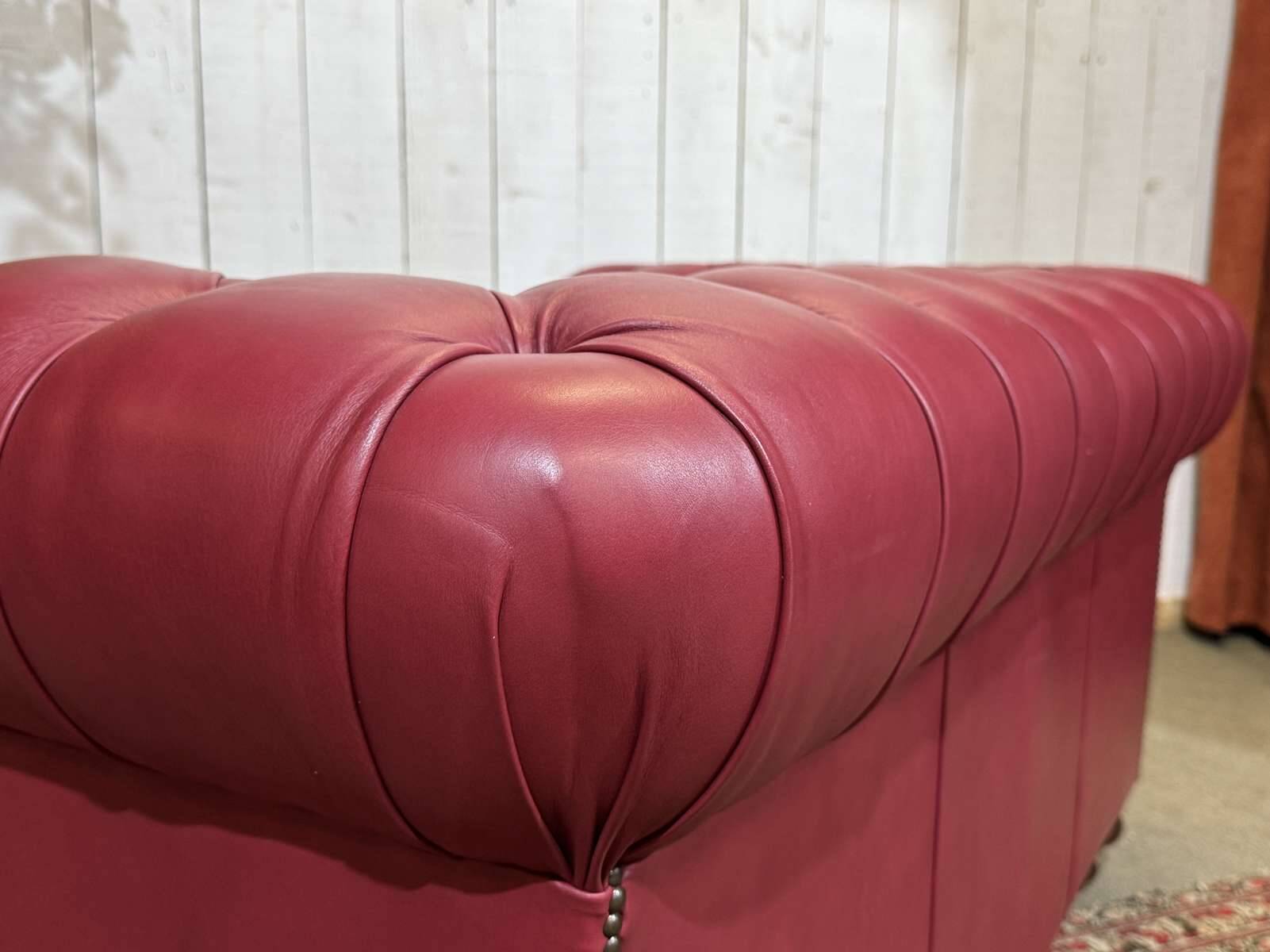 Chesterfield 2-seater leather sofa, modern production from the 2000s.