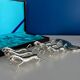 Set of 6 vintage silver metal knife holders and bottle opener, chev design
