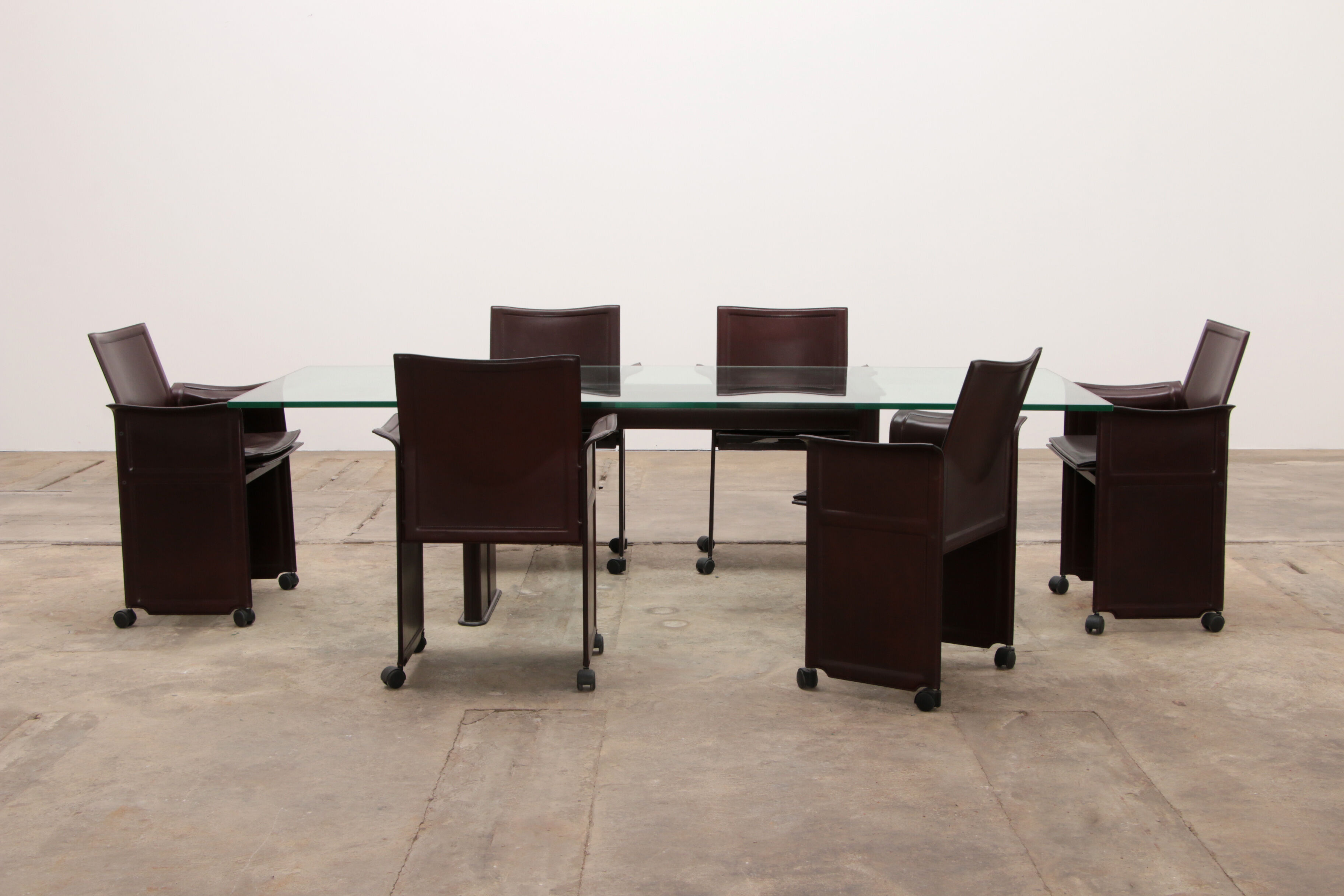 Tito Agnoli for Matteo Grassi leather dining table and six chairs