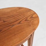 Timeless French Art Deco carved oval side table in oak, 1930s