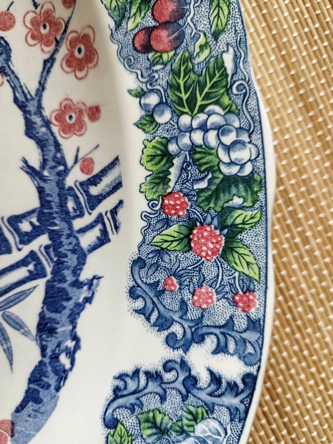 Oval Japanese plate with peacock decoration.