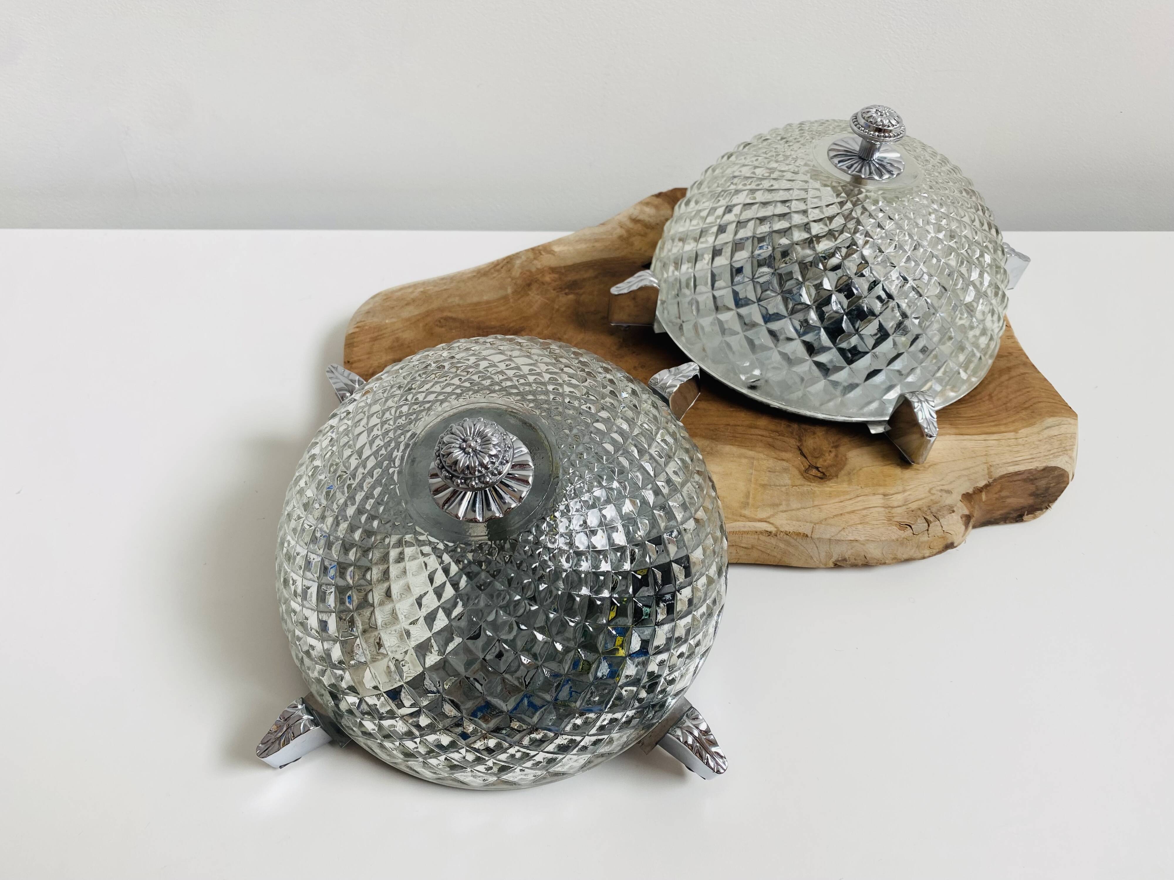 Pair of chrome-plated glass sconces