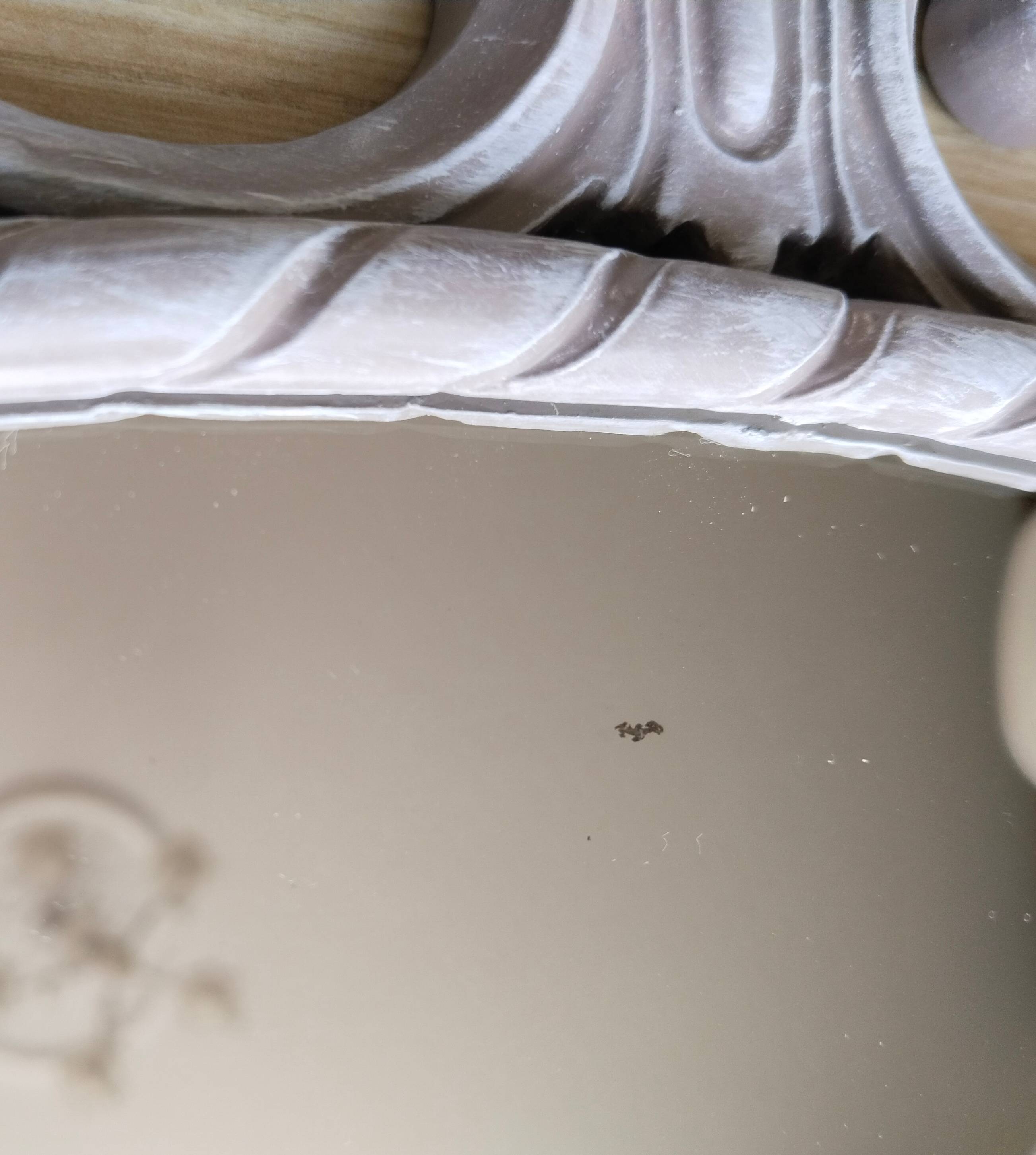 Louis XVI style patinated oval mirror