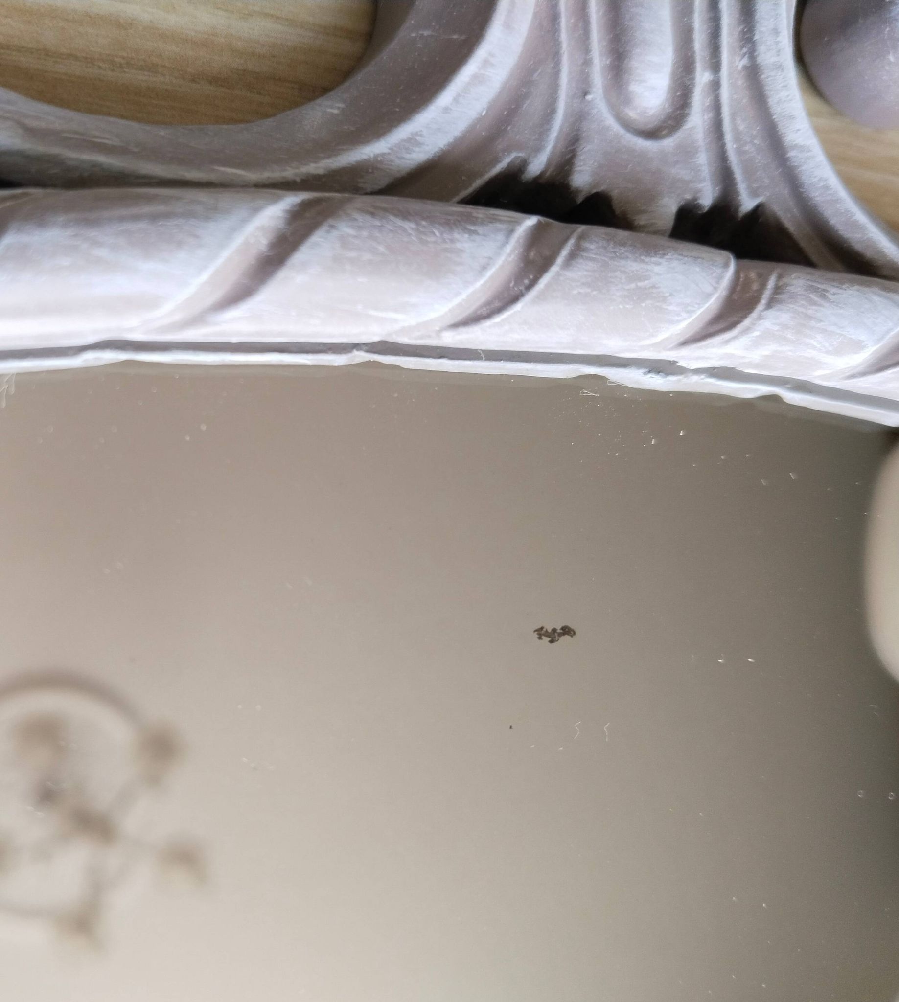 Louis XVI style patinated oval mirror