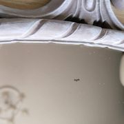 Louis XVI style patinated oval mirror