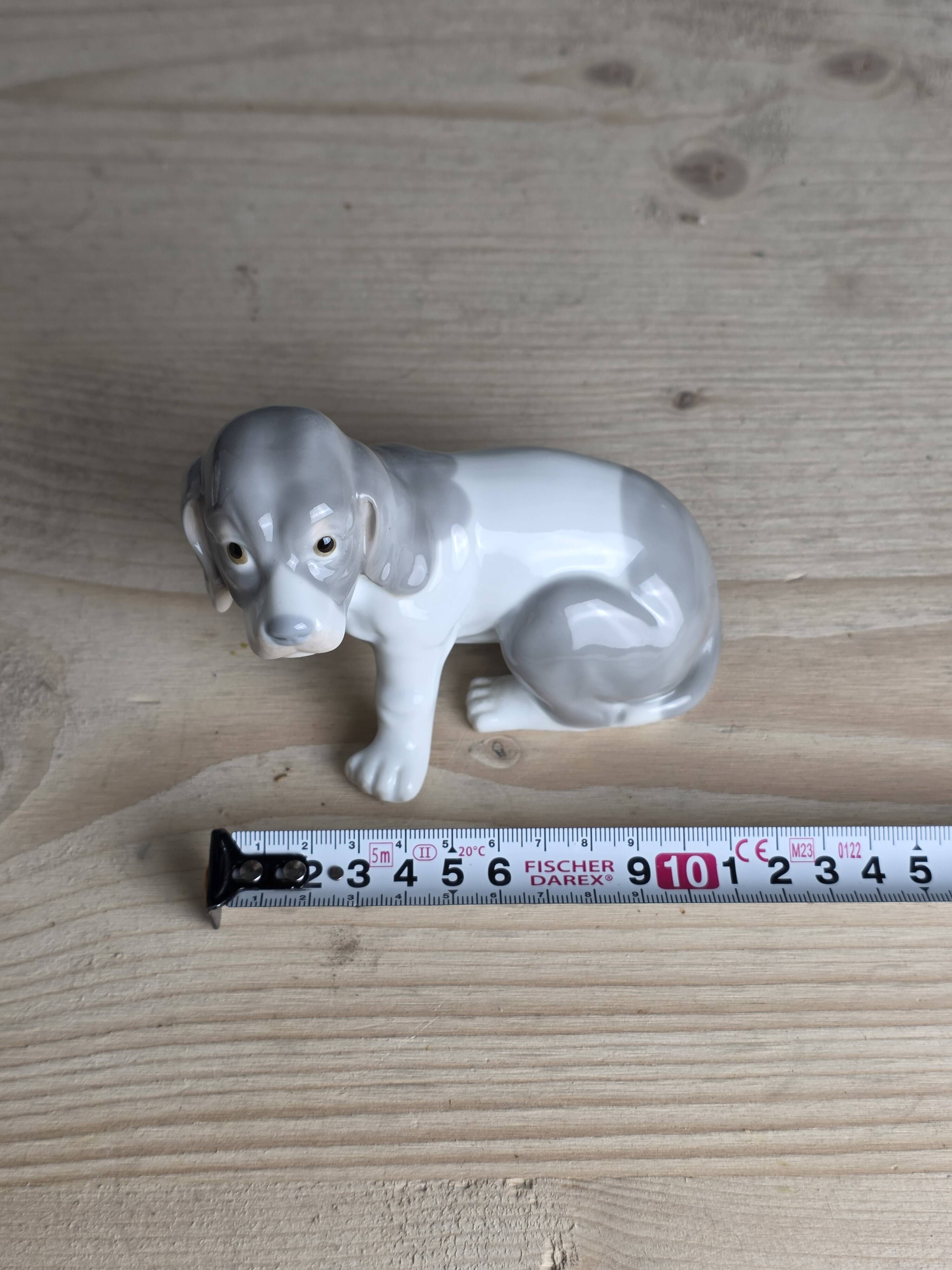 Small spaniel dog in porcelain