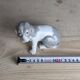 Small spaniel dog in porcelain