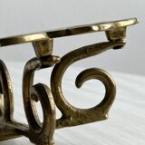 Brass trivet with openwork pattern in the shape of apples.